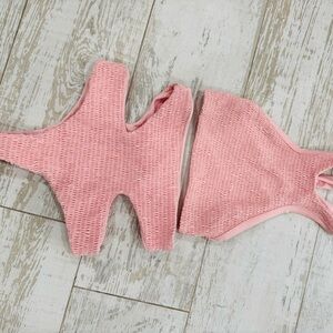 Tori praver high waisted swim wear.